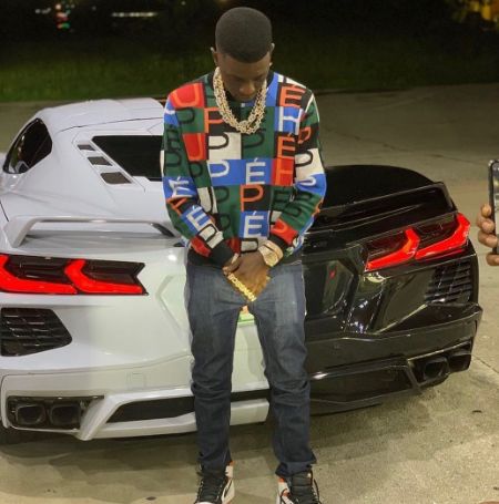 Lil Boosie took a picture behind a supercar and captioned the post, Hustler.